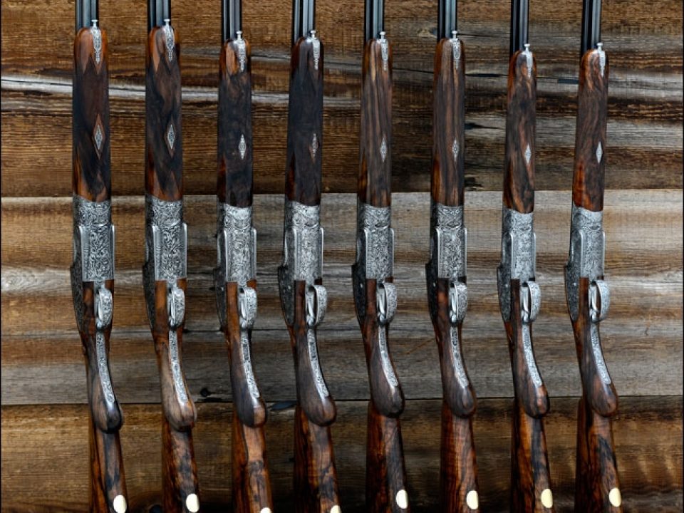 The Only Available “Holland & Holland Royal Deluxe Flight” With Deep-Relief Fantasy-Style Gargoyle Engraving by Philippe Grifnée in Consecutively Numbered Matched Pairs of 12, 20, 28 and .410 Bores