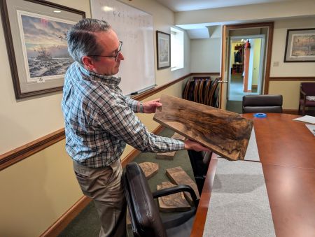 Taking Stock: Confessions of a Custom-Fit Convert 3 After spraying water on the stock, Krieghoff International CEO Alex Diehl shows the author a blank from the company’s inventory.